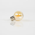 Lampadina LED [G60] a filamento sferica Ø6cm / Vetro ambrato